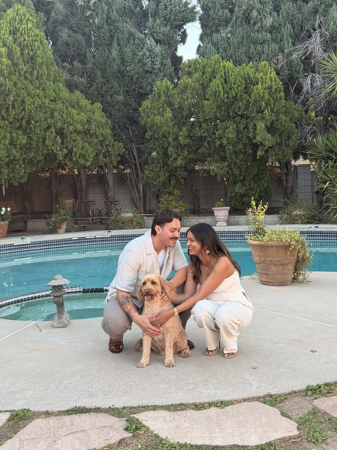 Anishka and Jack laughing with Coco